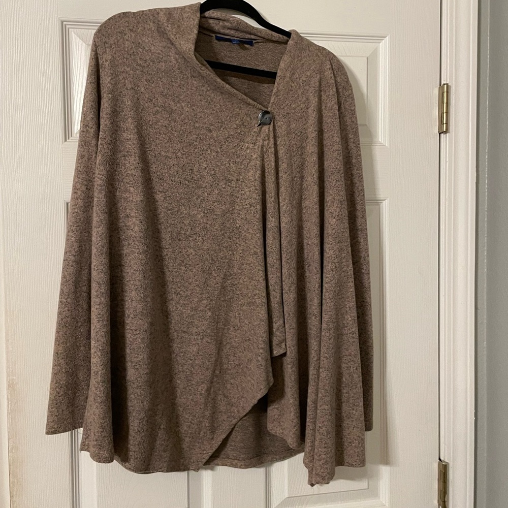 tan cardigan. Buttons on the shoulder